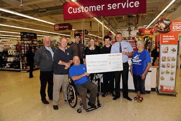 presentation of the cheque in front of the customer service desk in Sainsbury's Carrickfergus